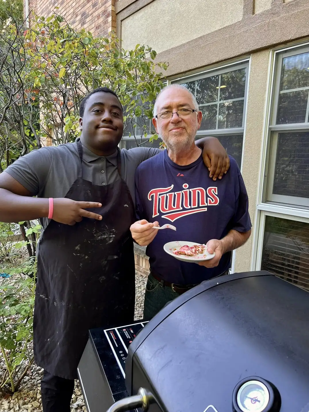 Resident enjoying outdoor dining at The Alton
