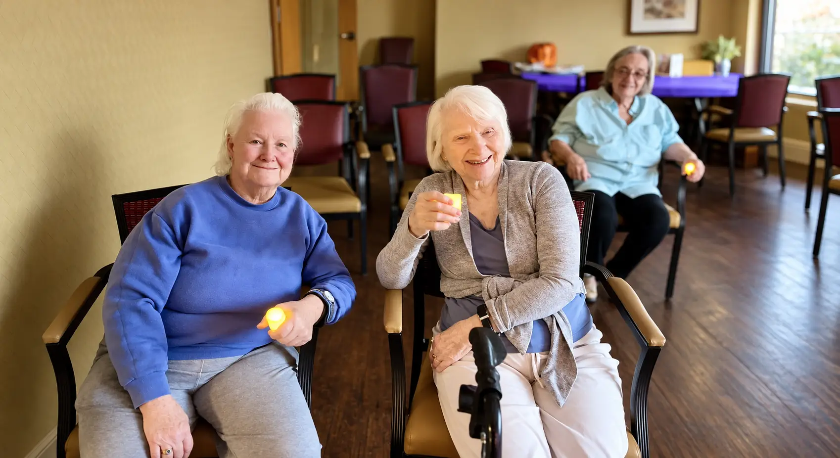 Residents gathered in a common area at The Alton